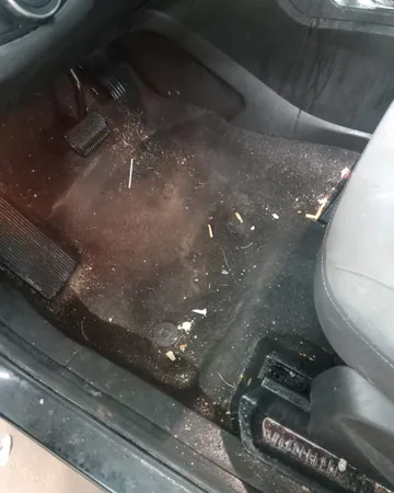 Driver's footwell full of debris and dirt
