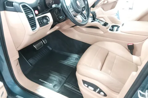 Clean tan leather interior of a Porsche Cayenne after detailing
